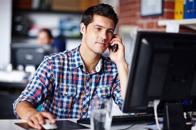 man on cell phone in office